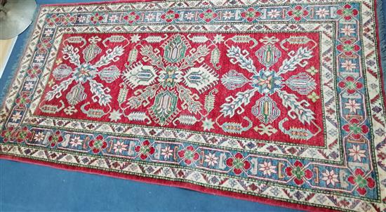 An Afghan rug 230 x 118cm